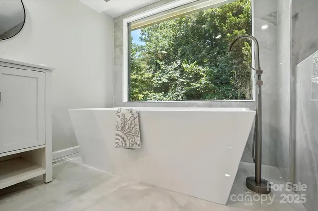 a livingroom with wooden floor and furniture
