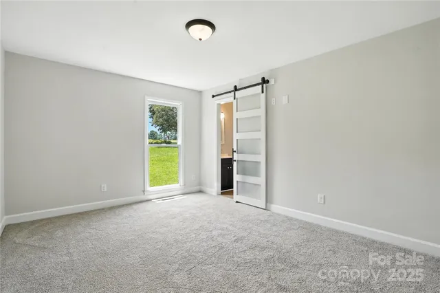 a bathroom with a glass shower door