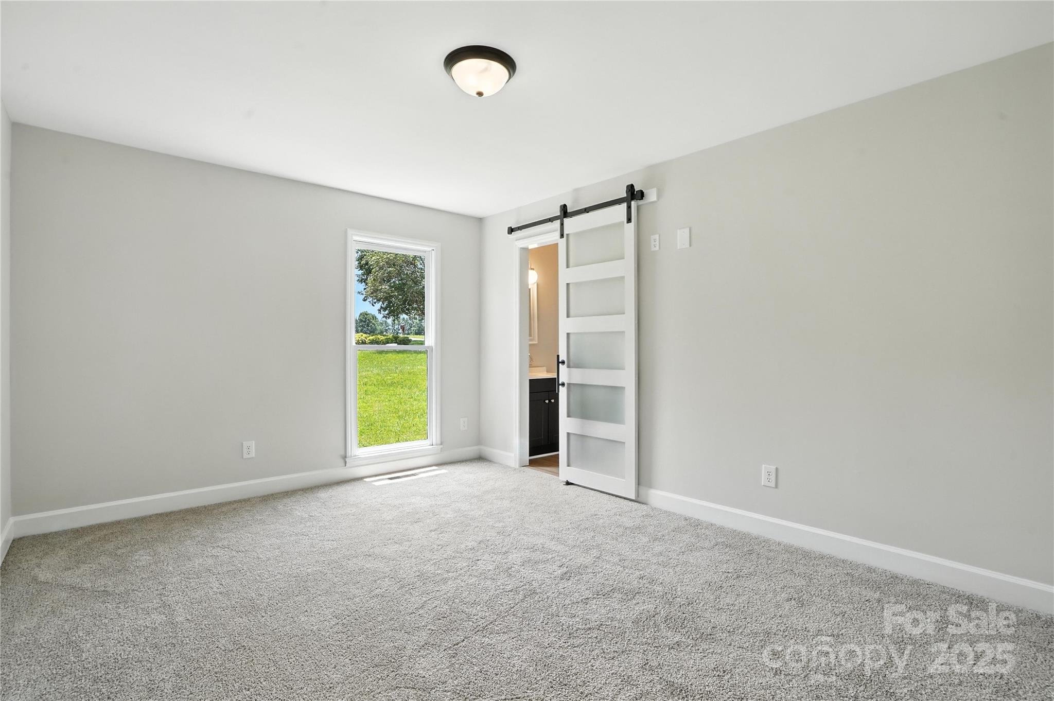 7109 Forney Hill Road Denver, NC 28037 - Photo 28 of 45 a view of an empty room with a window