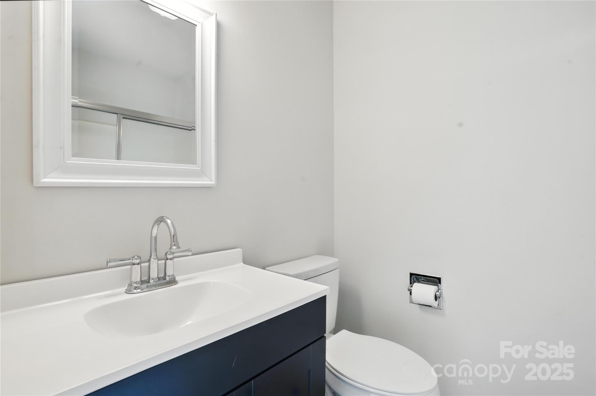 7109 Forney Hill Road Denver, NC 28037 - Photo 29 of 45 a bathroom with a sink a toilet and mirror