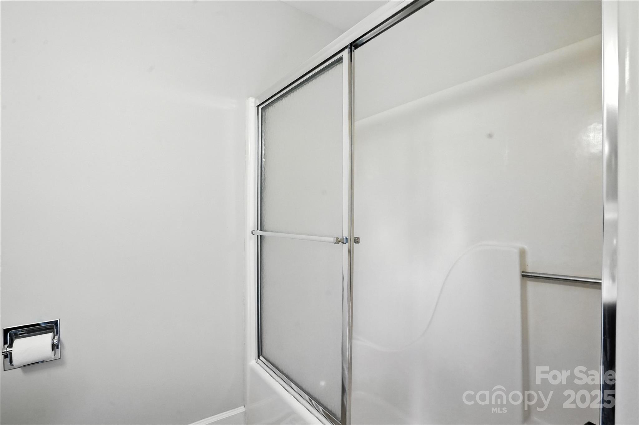 7109 Forney Hill Road Denver, NC 28037 - Photo 30 of 45 a bathroom with a glass shower door