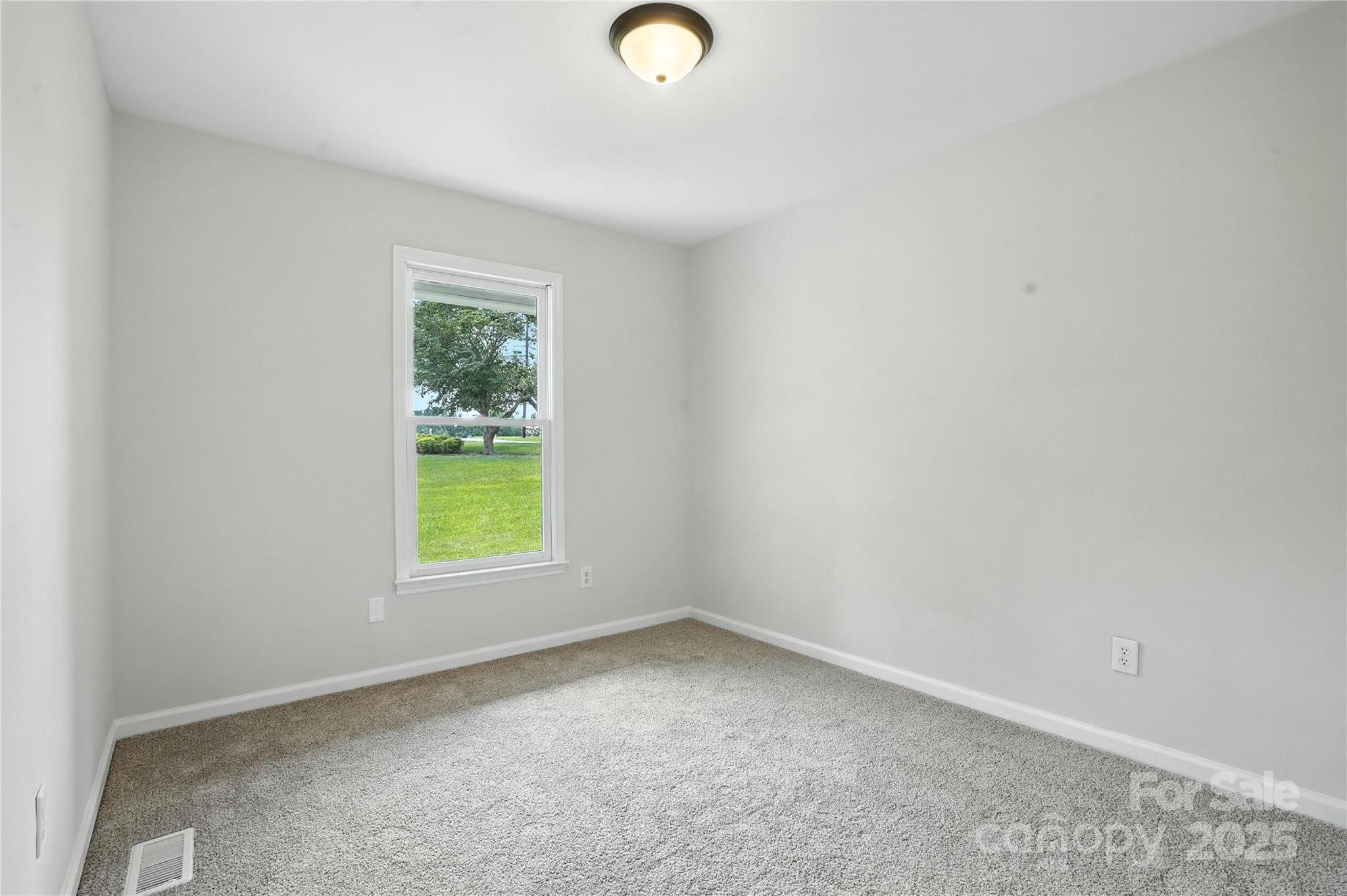 7109 Forney Hill Road Denver, NC 28037 - Photo 31 of 45 an empty room with window