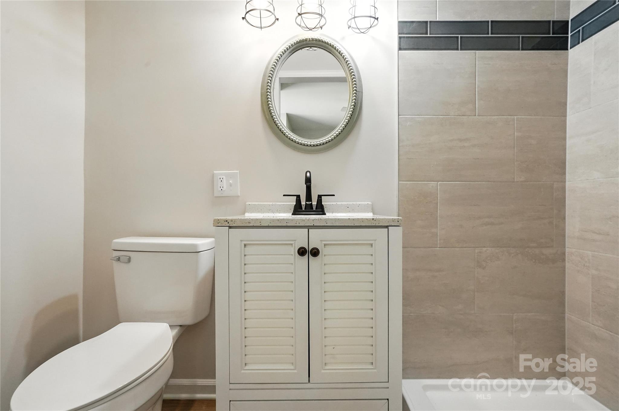 7109 Forney Hill Road Denver, NC 28037 - Photo 35 of 45 a bathroom with a sink a toilet and shower
