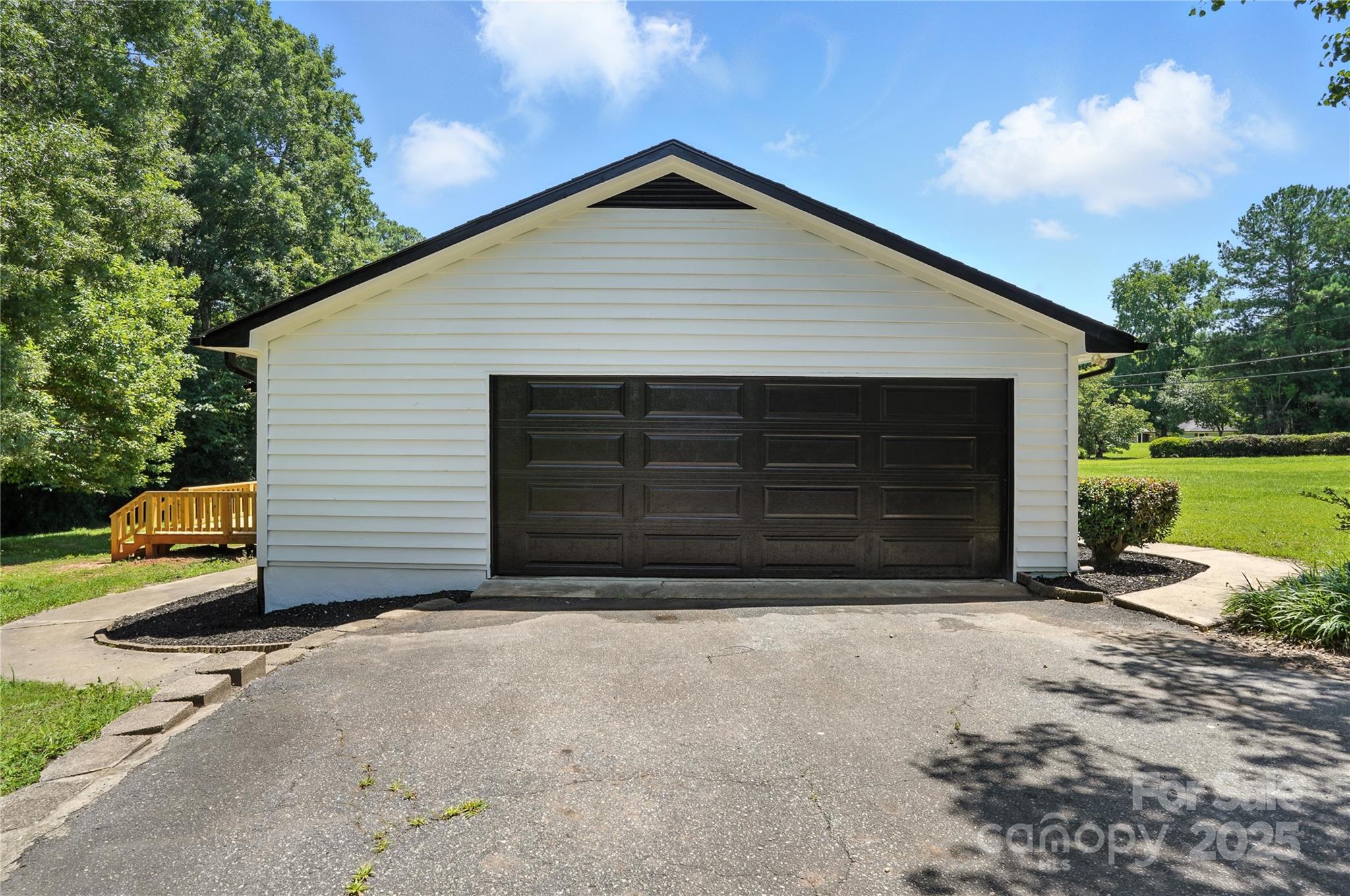 7109 Forney Hill Road Denver, NC 28037 - Photo 37 of 45 a front view of a house with garden