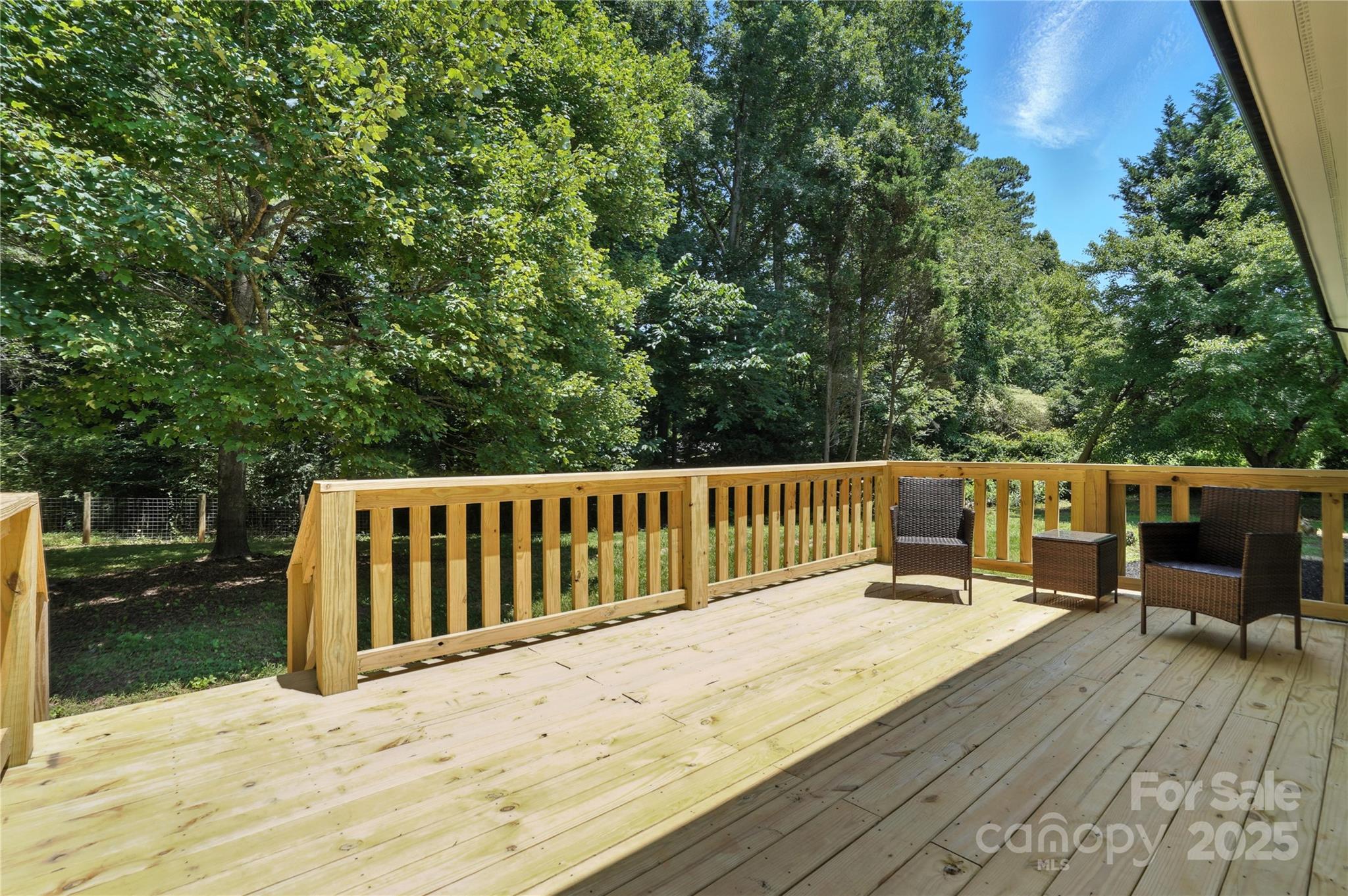 7109 Forney Hill Road Denver, NC 28037 - Photo 44 of 45 a view of a deck with wooden floor and fence with a bench