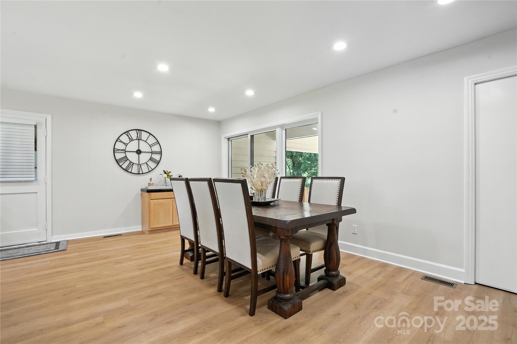 7109 Forney Hill Road Denver, NC 28037 - Photo 8 of 45 a view of a dining room with furniture window and wooden floor