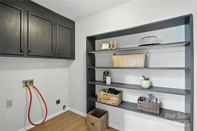 a living room with white cabinets