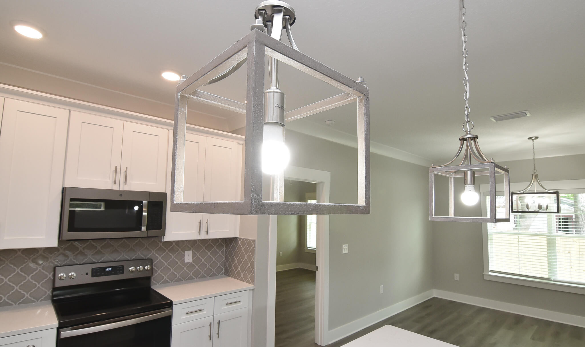 667 Red Fern Road Crestview, FL 32536 - Photo 21 of 32 a kitchen with stainless steel appliances a stove a refrigerator and microwave