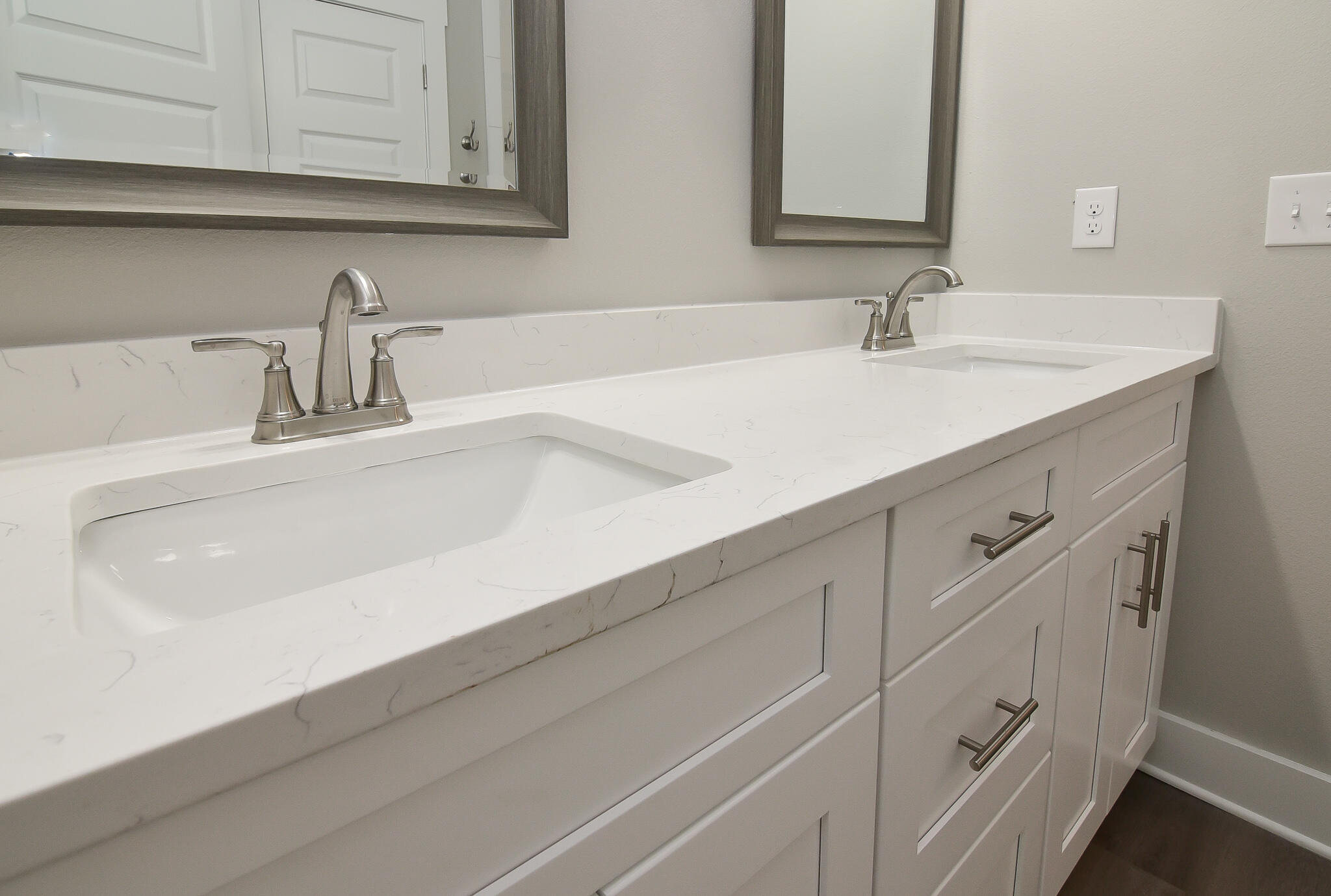 667 Red Fern Road Crestview, FL 32536 - Photo 25 of 32 a bathroom with white cabinets sink and mirror