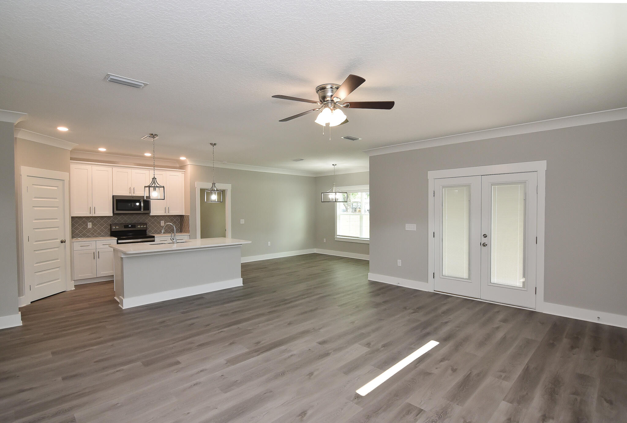 667 Red Fern Road Crestview, FL 32536 - Photo 26 of 32 a view of kitchen with sink and wooden floor