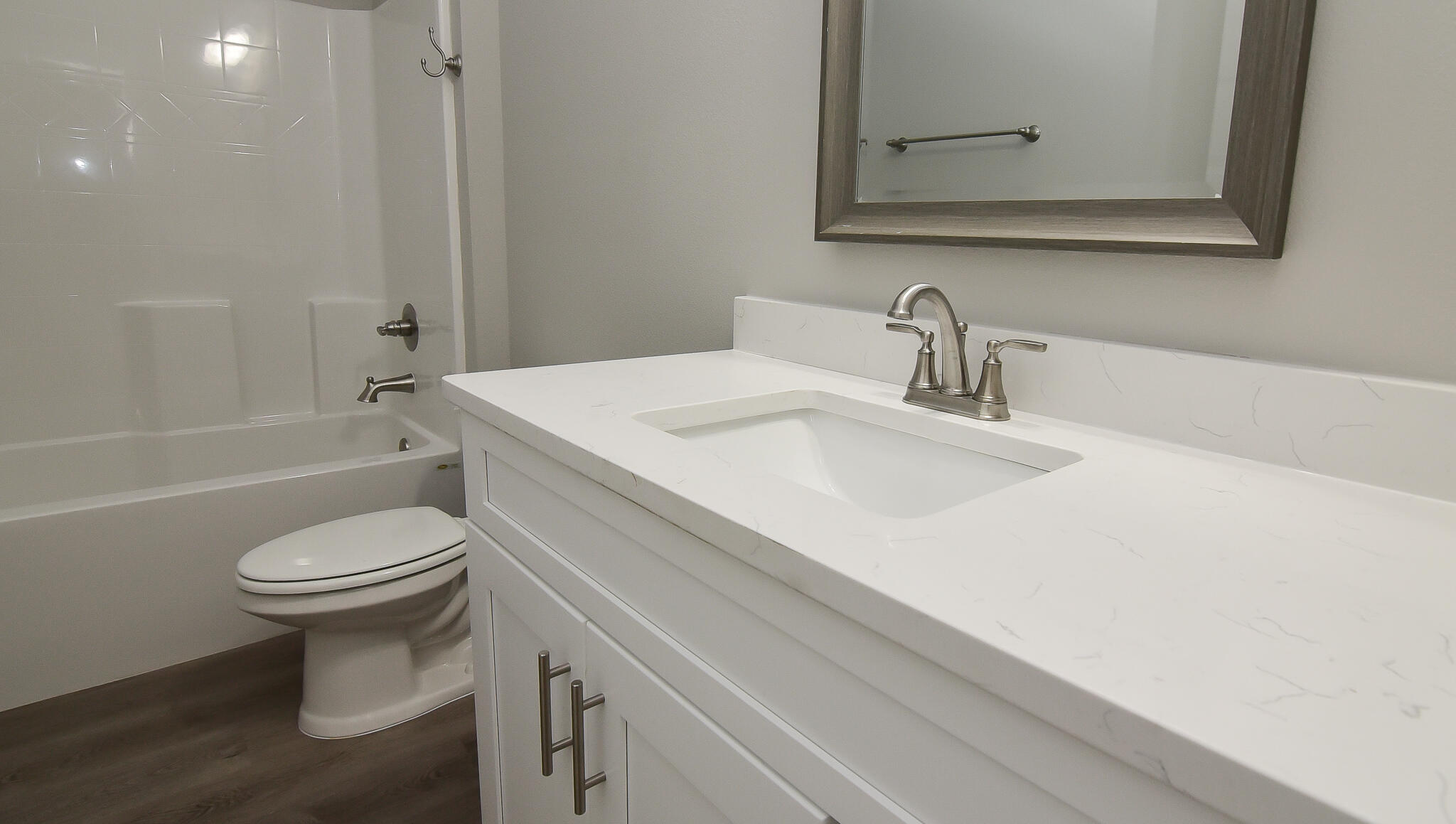 667 Red Fern Road Crestview, FL 32536 - Photo 27 of 32 a bathroom with a sink toilet vanity and shower