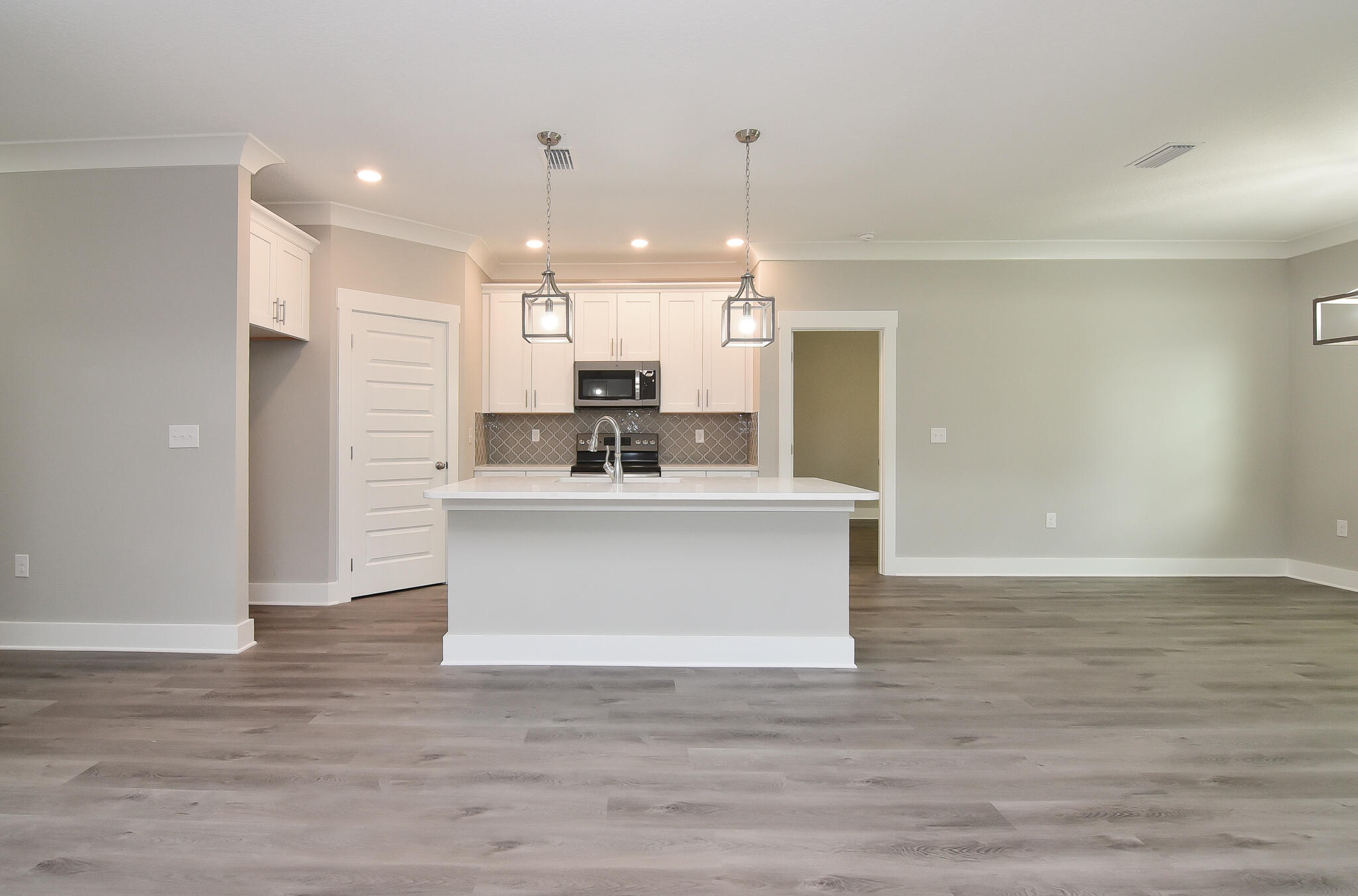 667 Red Fern Road Crestview, FL 32536 - Photo 8 of 32 a view of kitchen with kitchen island white cabinets and stainless steel appliances