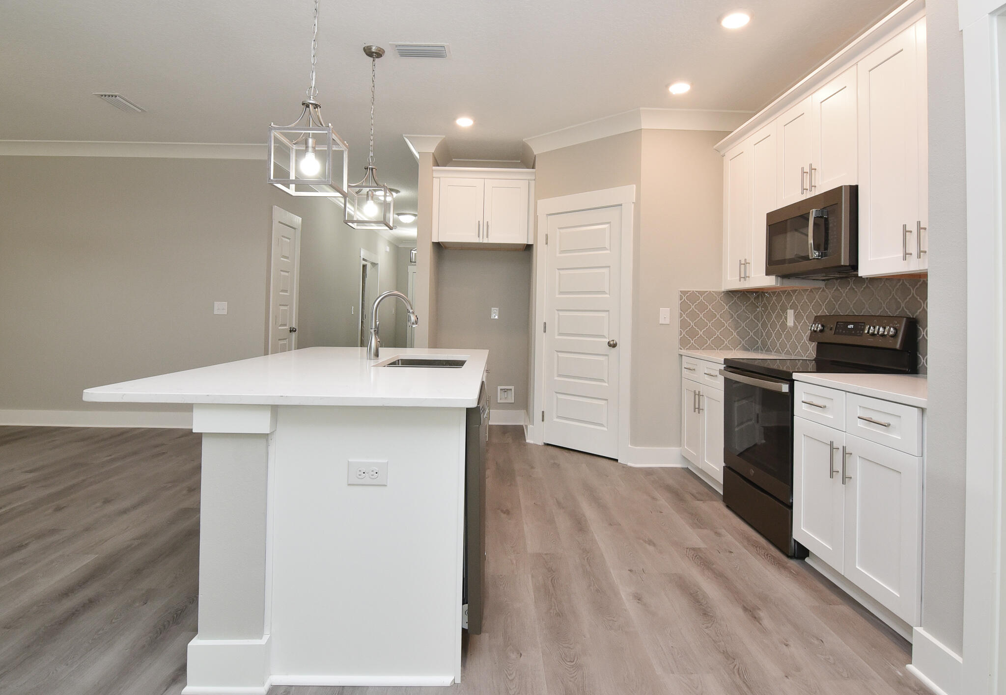 667 Red Fern Road Crestview, FL 32536 - Photo 10 of 32 a kitchen with a sink stainless steel appliances and cabinets