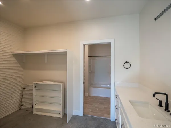 a bathroom with a bathtub and a sink