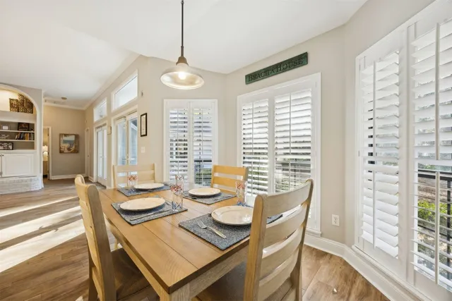 a bedroom with double bed and a chandelier