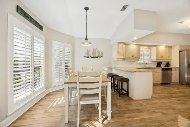 a utility room with sink dryer and washer
