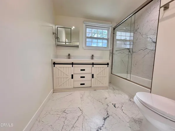 a bathroom with a bathtub sink and toilet