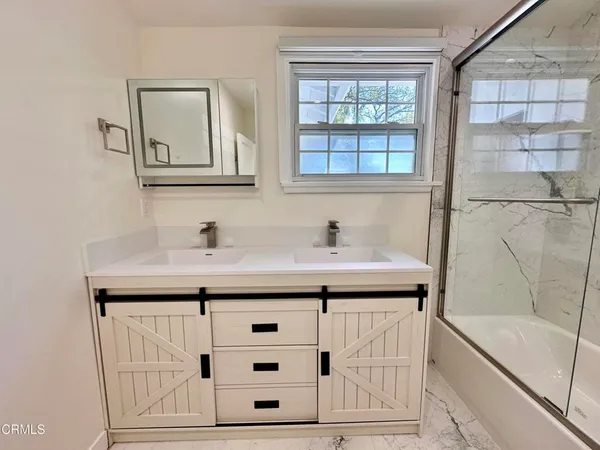 a bathroom with a sink and a bathtub