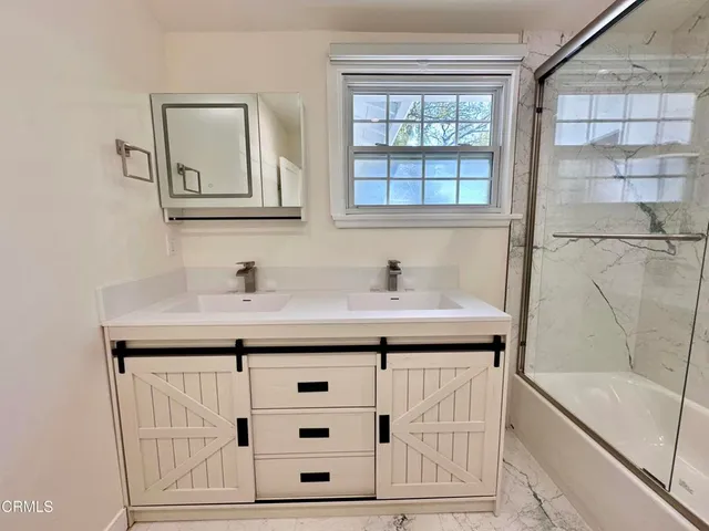 a bathroom with a sink and a bathtub