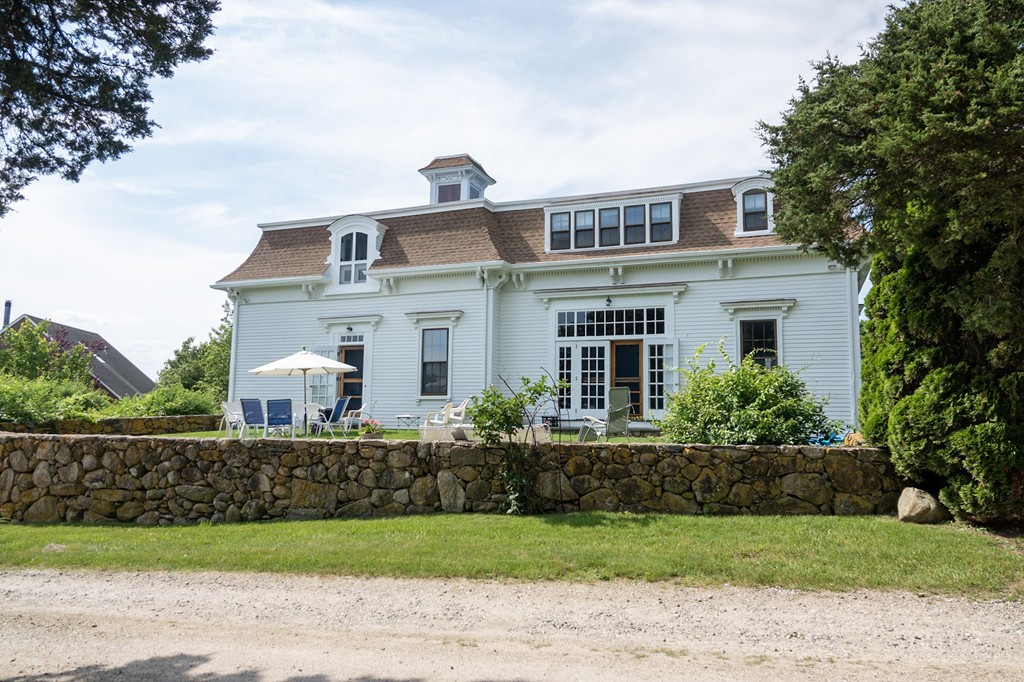 1991 B Main Road, Unit VAC RENTAL Westport, MA 02791 - Photo 1 of 17 a front view of a house with a garden