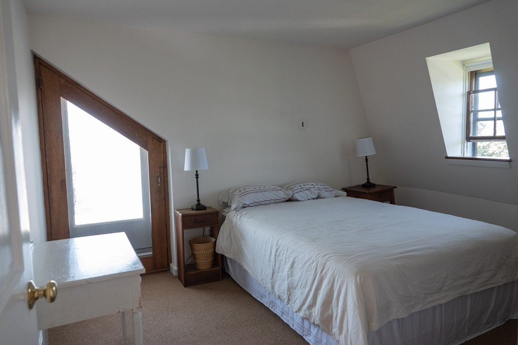 1991 B Main Road, Unit VAC RENTAL Westport, MA 02791 - Photo 12 of 17 a bedroom with a bed and a window