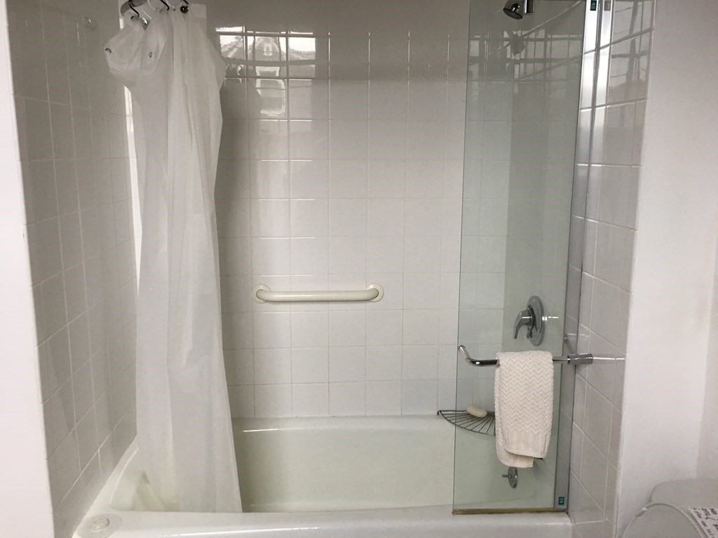 1991 B Main Road, Unit VAC RENTAL Westport, MA 02791 - Photo 15 of 17 a bathroom with a glass shower door