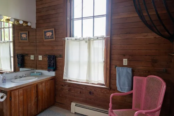 a bathroom with a sink and mirror
