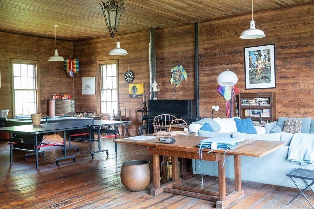 1991 B Main Road, Unit VAC RENTAL Westport, MA 02791 - Photo 6 of 17 a living room with fireplace furniture and a window