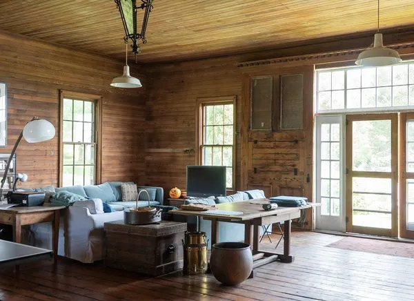 a view of a livingroom with furniture and window