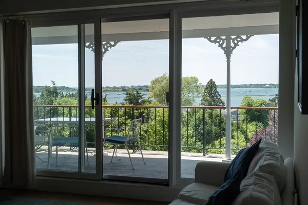 a room with a large window and a bed