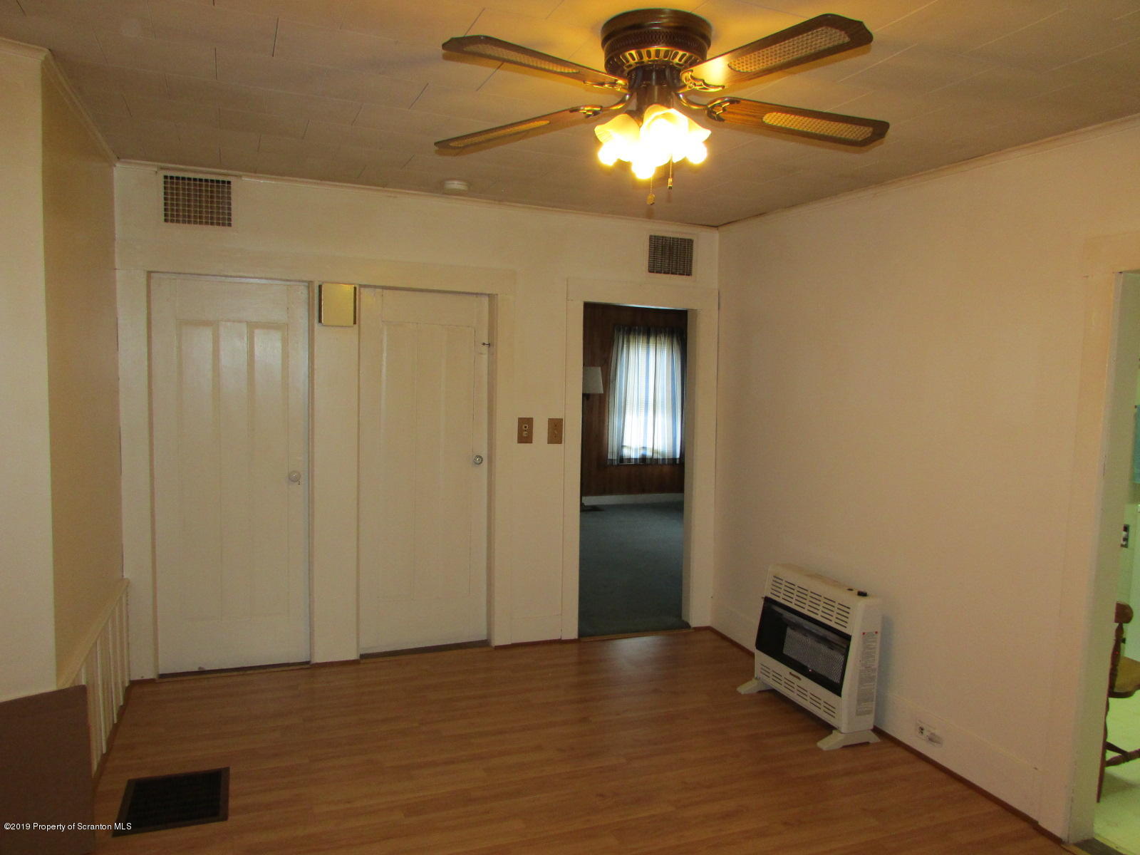 6704 Lindaville Road Kingsley, PA 18826 - Photo 8 of 32 a view of a livingroom with a chandelier fan