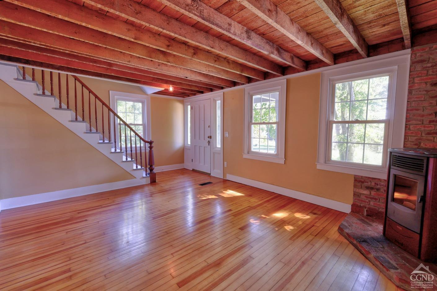 21 Irondale Road Millerton, NY 12546 - Photo 12 of 73 a view of an empty room with wooden floor and a window