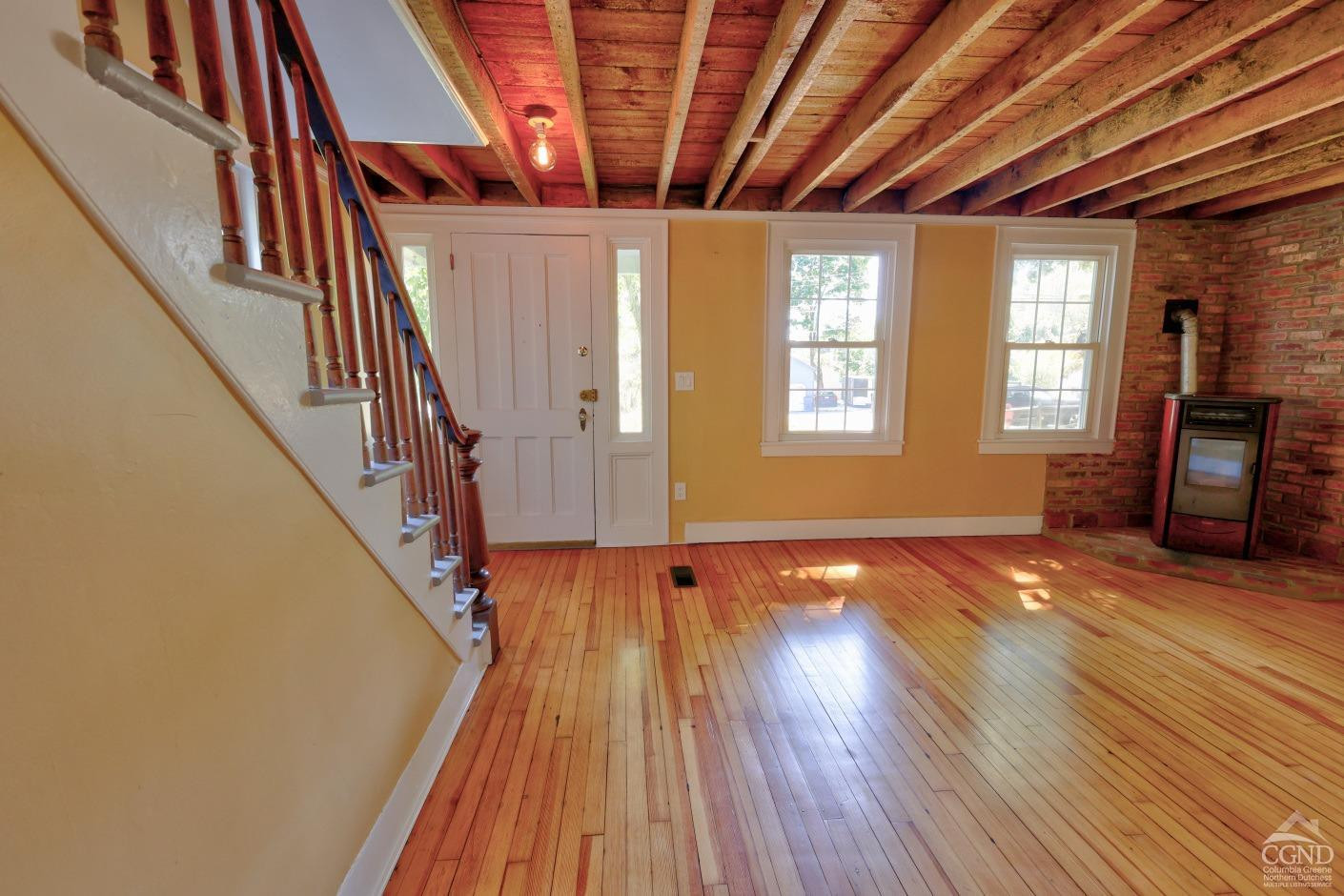 21 Irondale Road Millerton, NY 12546 - Photo 16 of 73 a view of an empty room with wooden floor and a window