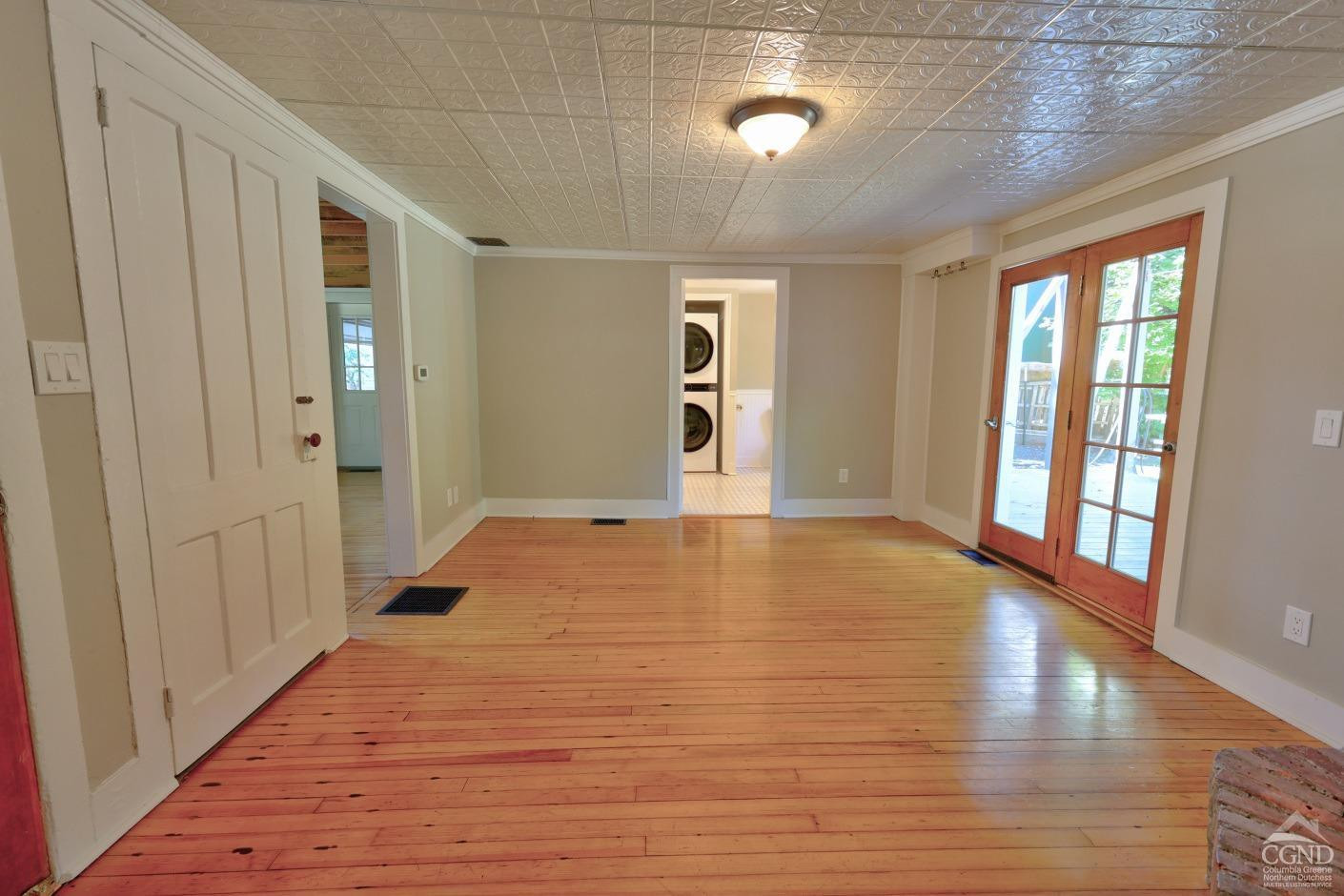 21 Irondale Road Millerton, NY 12546 - Photo 17 of 73 a view of an empty room with wooden floor and a window