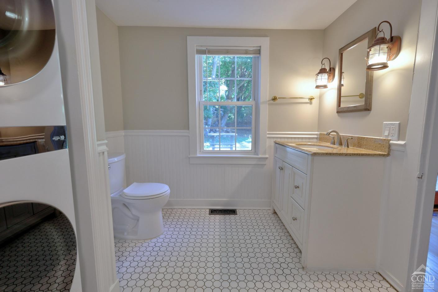 21 Irondale Road Millerton, NY 12546 - Photo 32 of 73 a bathroom with a sink toilet and window