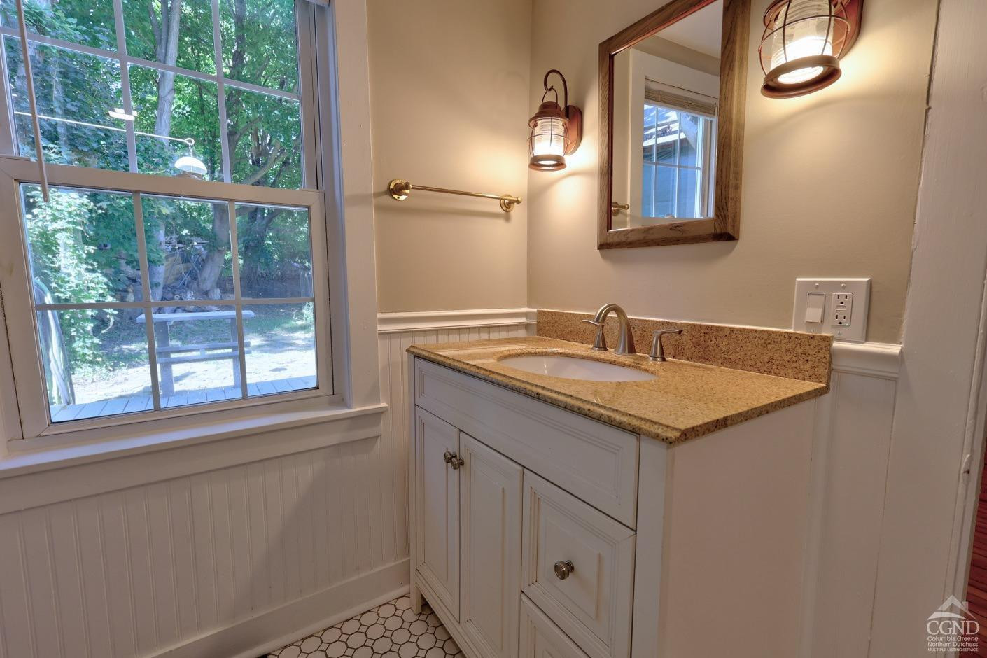 21 Irondale Road Millerton, NY 12546 - Photo 36 of 73 a bathroom with a sink and a mirror