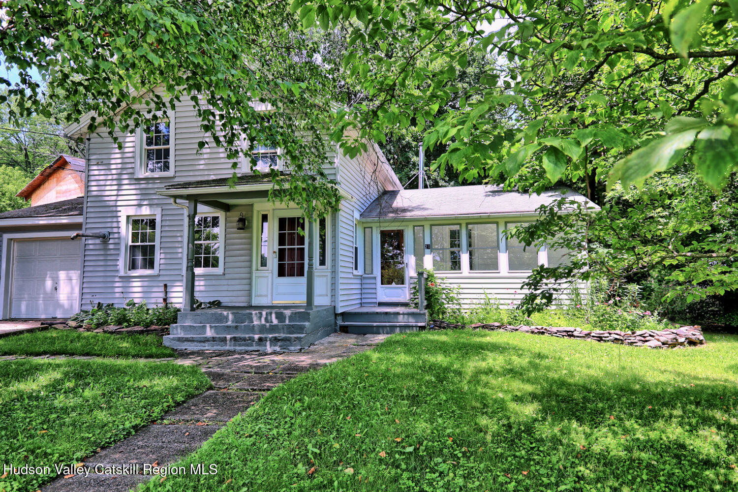 21 Irondale Road Millerton, NY 12546 - Photo 4 of 73 a front view of a house with garden