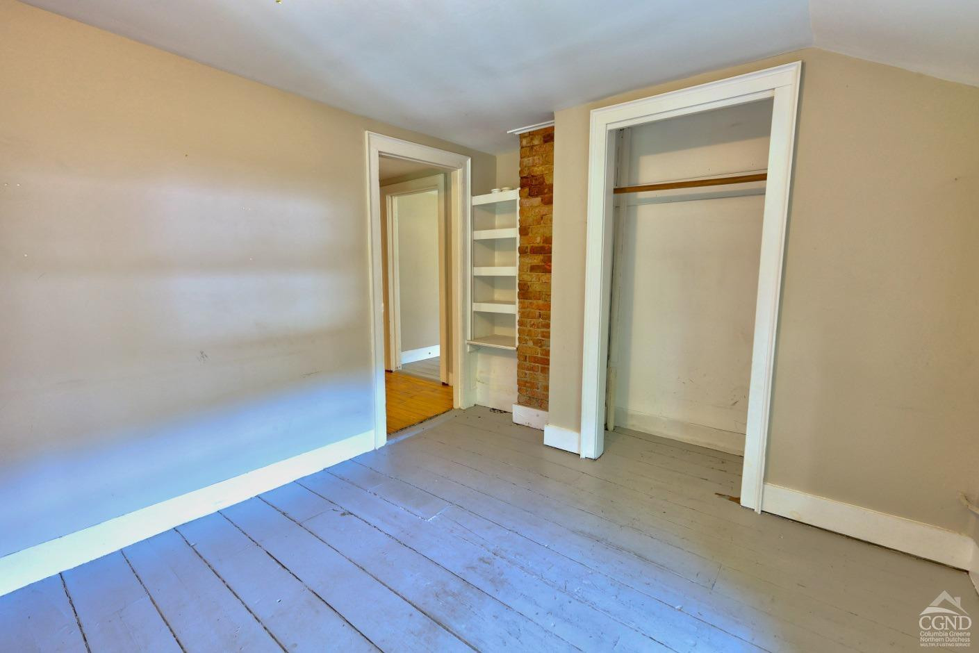 21 Irondale Road Millerton, NY 12546 - Photo 46 of 73 an empty room with wooden floor and closet