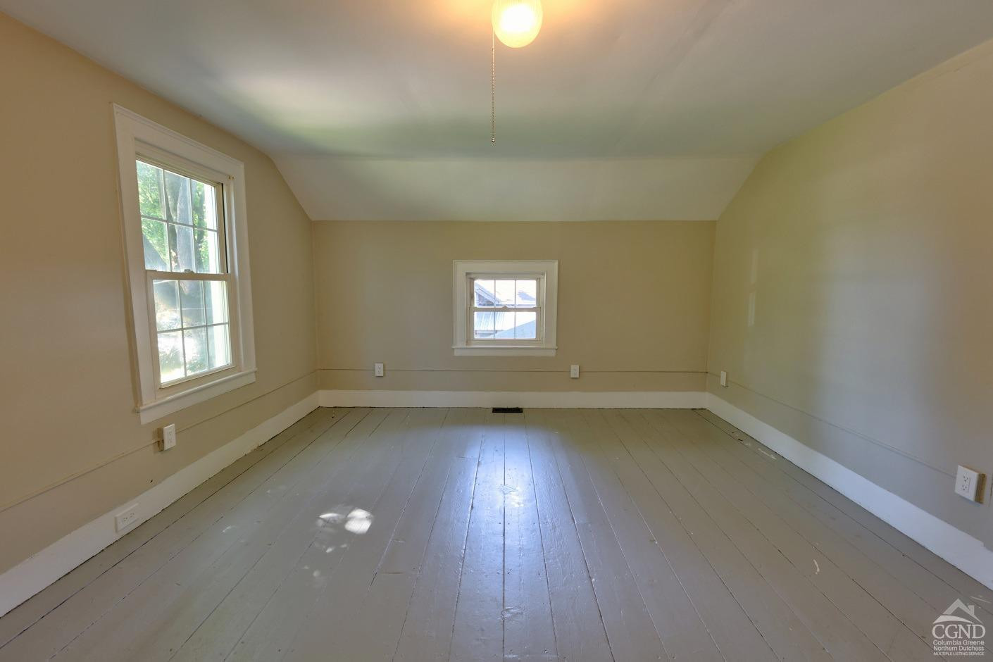 21 Irondale Road Millerton, NY 12546 - Photo 48 of 73 an empty room with wooden floor and windows