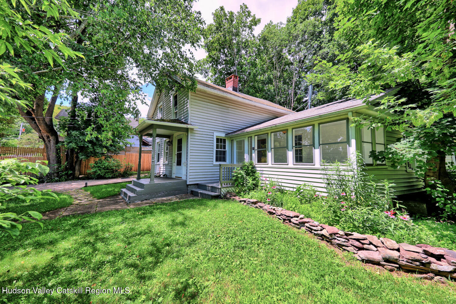21 Irondale Road Millerton, NY 12546 - Photo 70 of 73 a backyard of a house with plants and large tree