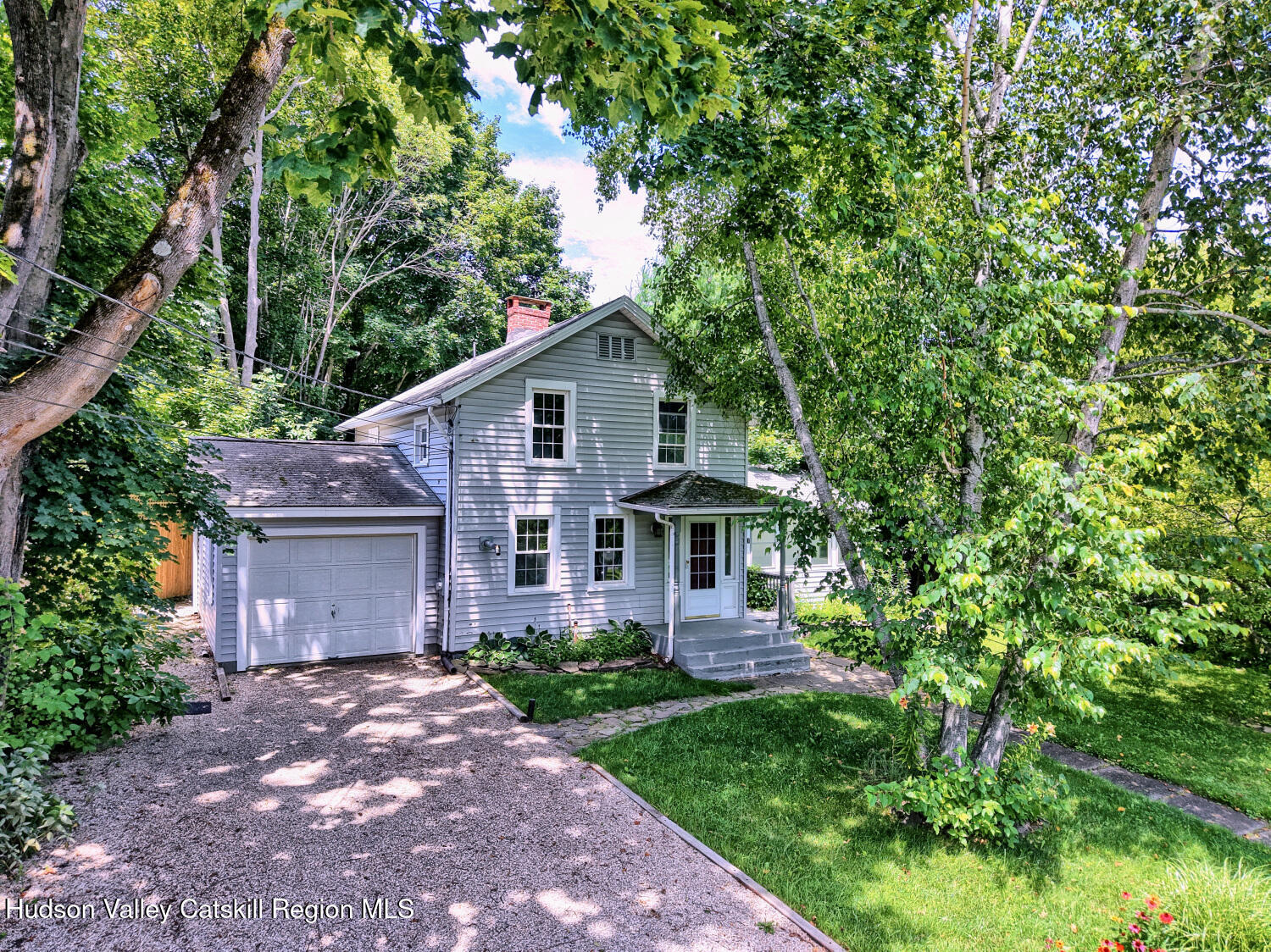21 Irondale Road Millerton, NY 12546 - Photo 8 of 73 a front view of a house with a garden