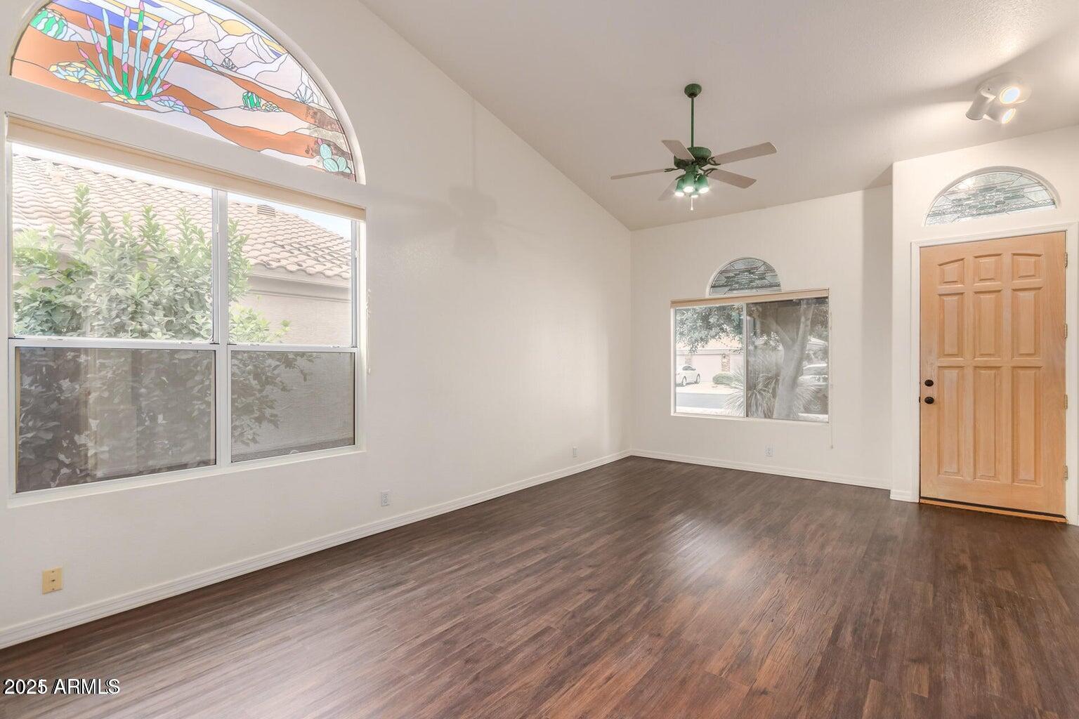6230 West Irma Lane Glendale, AZ 85308 - Photo 13 of 21 wooden floor in an empty room with a window