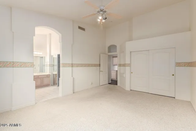 a view of an empty room with a cabinet