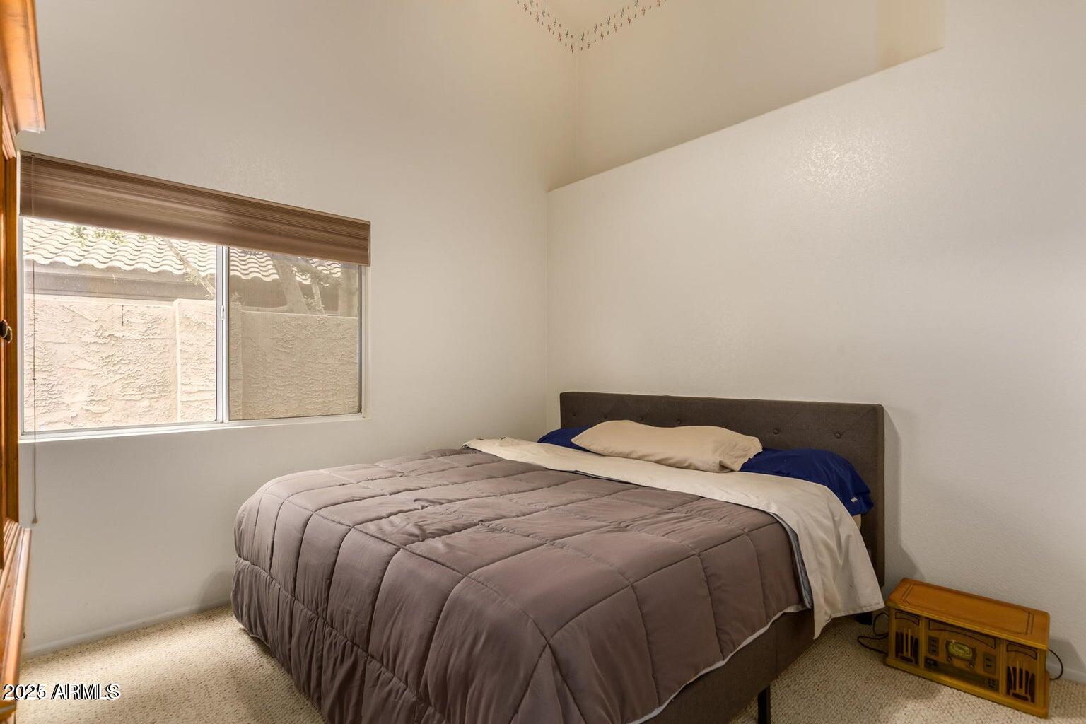 6230 West Irma Lane Glendale, AZ 85308 - Photo 3 of 21 a bedroom with a bed and window
