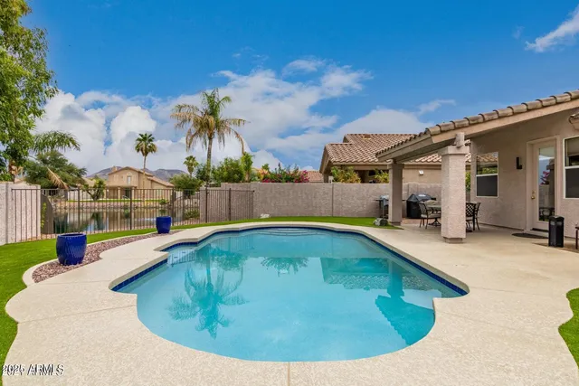 a view of a house with swimming pool