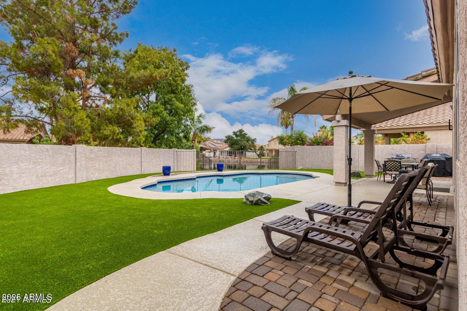 6230 West Irma Lane Glendale, AZ 85308 - Photo 7 of 21 a view of a swimming pool with a patio
