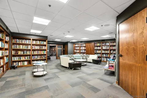 a living room with furniture and gym equipment