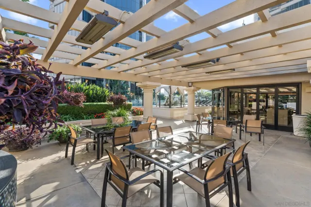 a view of a patio with wooden floor and fence