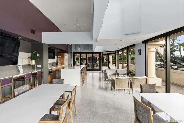 a living room with furniture and a book shelf