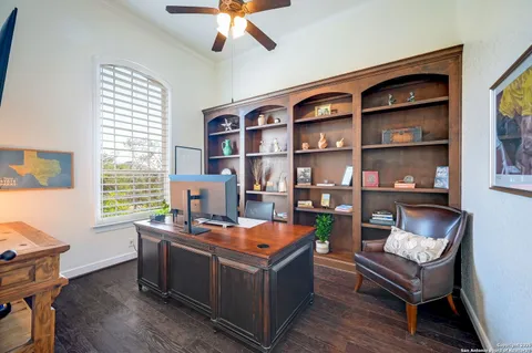 a room with furniture and a bookshelf
